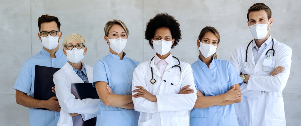 team-of-confident-medical-experts-with-protective-face-masks-1024px.jpg
